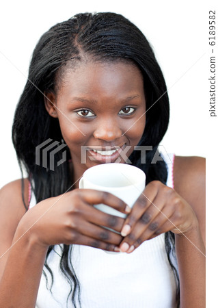 Jolly woman drinking a coffee Jolly woman drinking a coffee 6189582