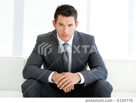 Charismatic male executive in a waiting room Charismatic male executive in a waiting room 6189776