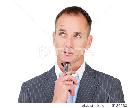 Pensive mature businessman holding glasses Pensive mature businessman holding glasses 6189980