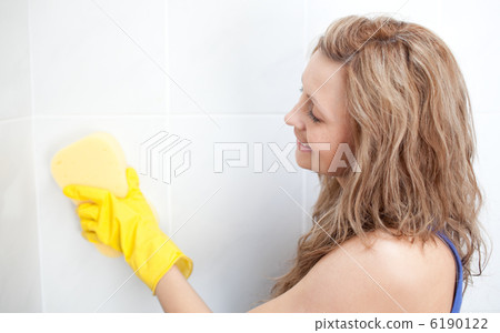 Attractive woman cleaning a bathroom Attractive woman cleaning a bathroom 6190122