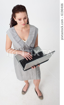 High angle of a thoughtful businesswoman using a laptop 6190486
