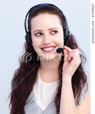 Brunette woman working in a call center Brunette woman working in a call center 6190687