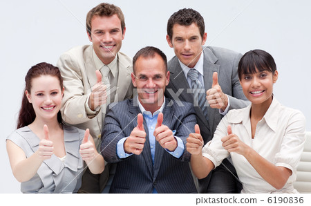 Happy business team with thumbs up 6190836
