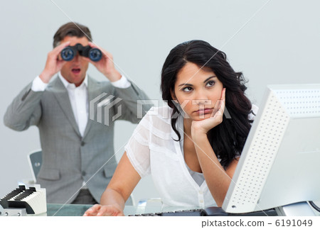 Brunette businesswoman getting bored and her manager looking thr Brunette businesswoman getting bored and her manager looking thr 6191049