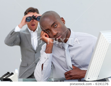Ethnic businessman getting bored and his manager looking through Ethnic businessman getting bored and his manager looking through 6191176