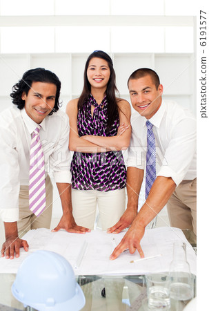 Smilinf female architect with folded arms in a meeting Smilinf female architect with folded arms in a meeting 6191577