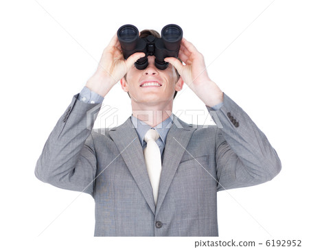 Young businessman looking up through binoculars 6192952