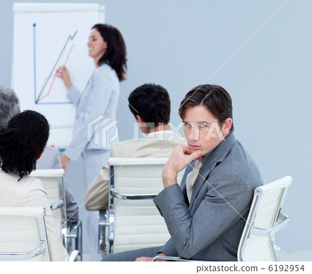 Bored charming businessman at a presentation Bored charming businessman at a presentation 6192954