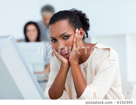 Bored young businesswoman at her desk Bored young businesswoman at her desk 6192995