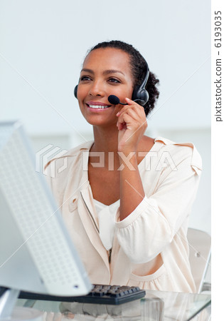 Positive businesswoman with headset on 6193035