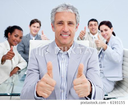 Mature manager celebrating a sucess with his team Mature manager celebrating a sucess with his team 6193155