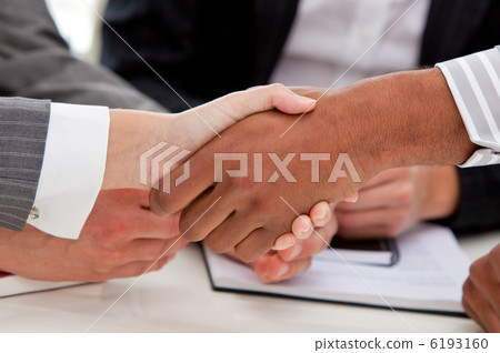 Close-up of businesspeople closing a deal Close-up of businesspeople closing a deal 6193160