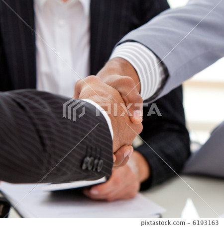 Close-up of businessmen closing a deal Close-up of businessmen closing a deal 6193163