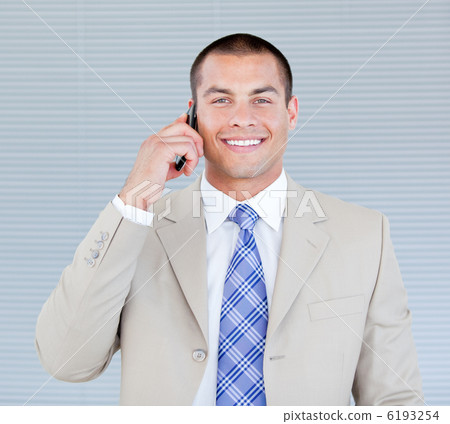 Self-assured businessman talking on phone Self-assured businessman talking on phone 6193254