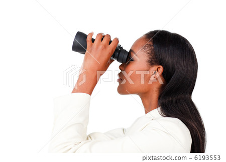 Charismatic businesswoman looking to the future through binocula Charismatic businesswoman looking to the future through binocula 6193553