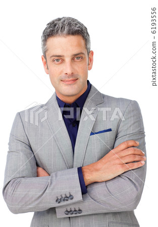 Charismatic businessman with folded arms 6193556