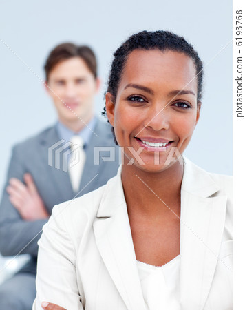 Charming business partners standing with folded arms 6193768