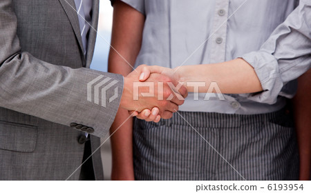 Close-up of a lucky businessteam closing a deal 6193954