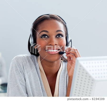 Portrait of a thoughtful businesswoman with headset on 6194109