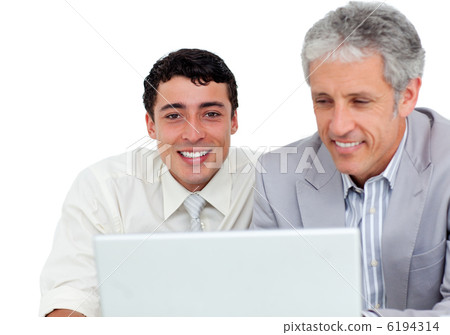 Charming business co-workers using a laptop Charming business co-workers using a laptop 6194314
