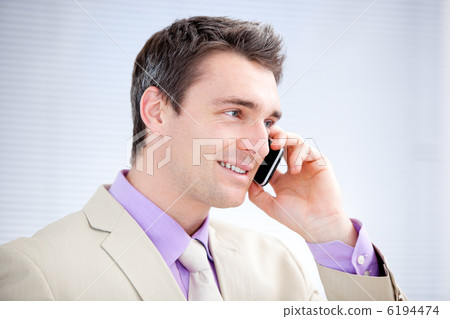 Positive businessman talking on phone Positive businessman talking on phone 6194474