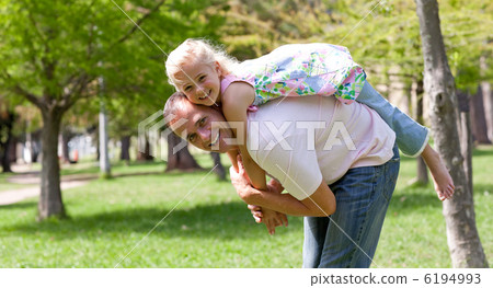 Cute little girl having fun with her father 6194993