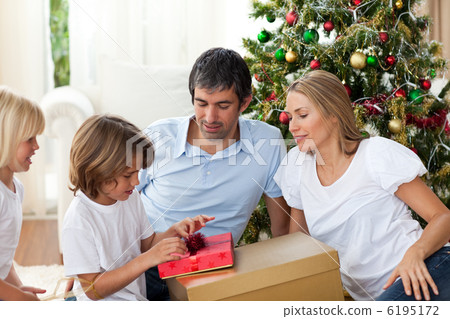 Cheerful family celebrating Christmas Cheerful family celebrating Christmas 6195172