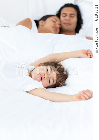 Parents and their son sleeping on the bed Parents and their son sleeping on the bed 6195311