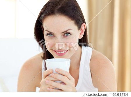 Close-up of a woman drinking a coffee Close-up of a woman drinking a coffee 6195784