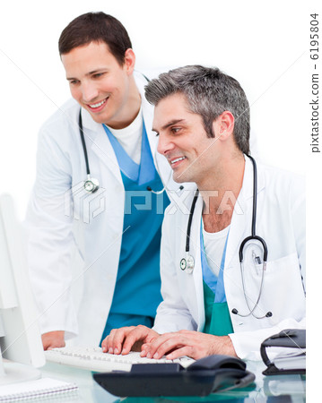 Two male doctors working at a computer Two male doctors working at a computer 6195804