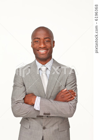 Smiling Afro-American businessman with folded arms 6196368