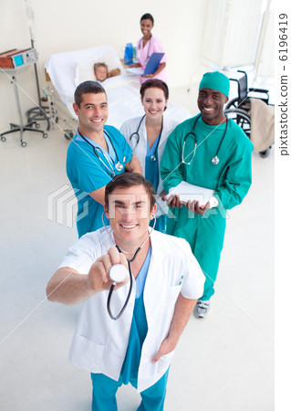 High angle of doctors with stethodcope in a patient room High angle of doctors with stethodcope in a patient room 6196419