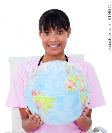 Portrait of an ethnic female doctor holding a terrestrial globe 6196535