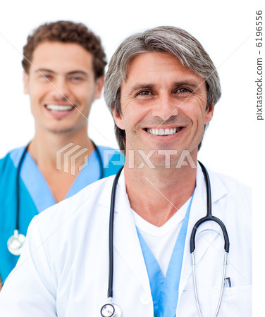 Cheerful male doctors smiling at the camera Cheerful male doctors smiling at the camera 6196556