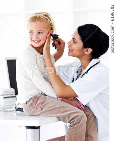 Cute little girl attending a medical check-up 6196582