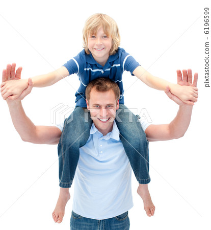 Charming father giving his son piggyback ride 6196599