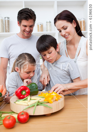 Happy parents and children cooking 6196630