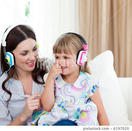 Portrait of a mother and her daughter listening music Portrait of a mother and her daughter listening music 6197020