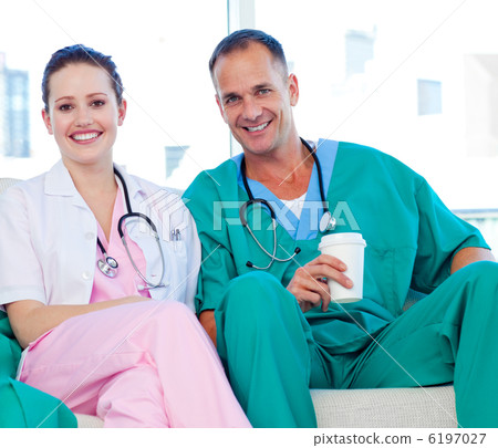 Two doctors relaxing in the staff room Two doctors relaxing in the staff room 6197027