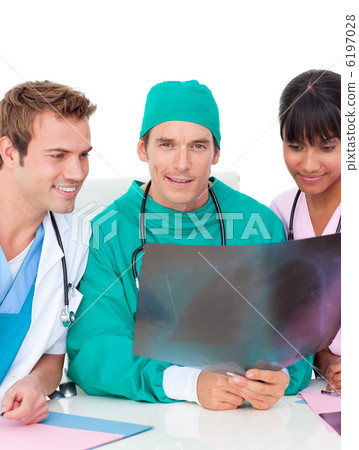 Ambitious medical team looking at X-ray Ambitious medical team looking at X-ray 6197028