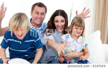 Excited family celebrating a goal 6197029