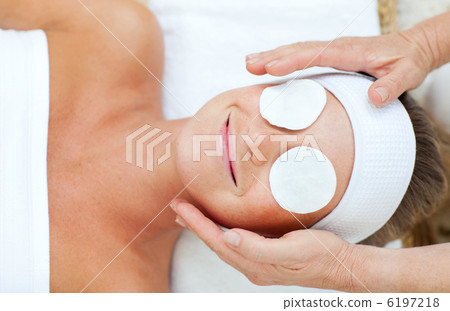Smiling woman enjoying a head massage Smiling woman enjoying a head massage 6197218