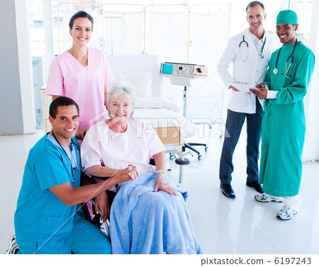 Attentive medical team taking care of a senior woman 6197243