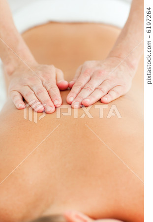 Back massage in a spa center Back massage in a spa center 6197264