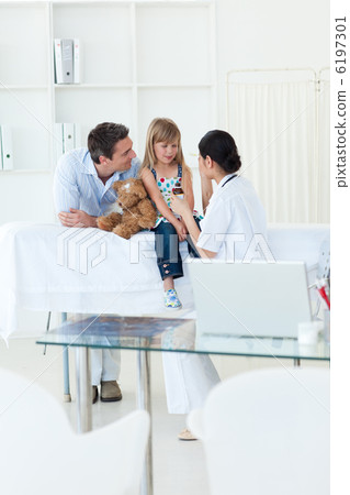 Femal doctor giving medecine to a patient Femal doctor giving medecine to a patient 6197301