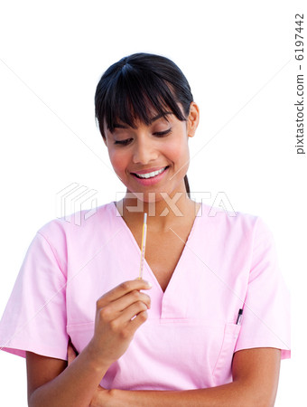 Portrait of an attractive nurse holding a thermometer Portrait of an attractive nurse holding a thermometer 6197442
