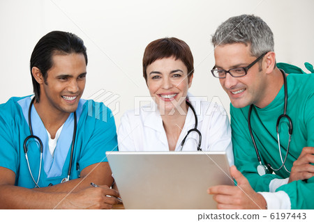 Group of doctors in a meeting Group of doctors in a meeting 6197443