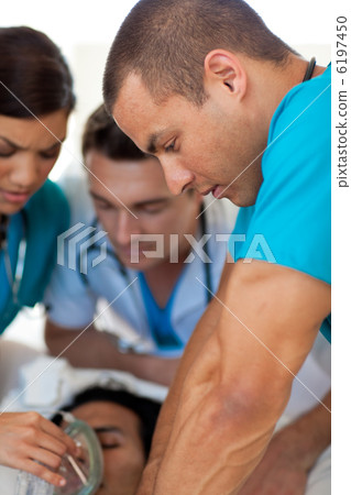 Doctors performing CPR on a patient Doctors performing CPR on a patient 6197450