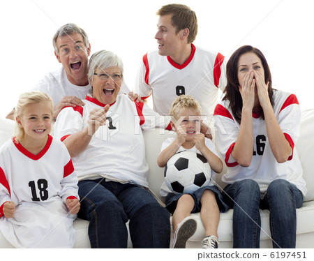Family watching a football match in television Family watching a football match in television 6197451