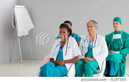 Medical team sitting at a conference Medical team sitting at a conference 6197565